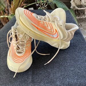 Nike Cream Low-Top Athletic Sneakers with Bright Orange Accents